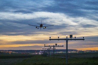 Arrival over brightly lit runway at dusk, Stuttgart Airport, Leinfelden-Echterdingen,