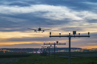 Airplane landing at dusk with illuminated runway, Stuttgart Airport, Leinfelden-Echterdingen,
