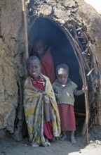 Maasai children in front of a hut in their village in the Ngorongoro Crater, Tanzania, June 2000,
