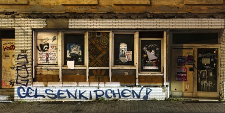Decaying façade covered with graffiti, no-go area in Gelsenkirchen, one of the poorest cities in