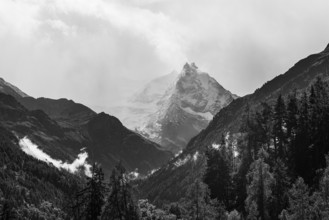 The summit of Mount Besso in fog, near Zinal, black and white photo, Val d'Anniviers, Valais Alps,
