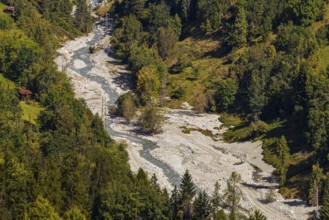 Power lines in the gravel bed of the Navisence stream, Val d'Anniviers, Valais Alps, Canton of