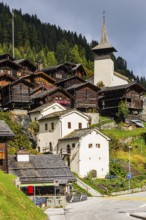White cellars, historic farmhouses, Saint Theodule church, Grimentz, Val d'Anniviers, Valais Alps,