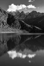 The Lac de Moiry reservoir, in the background the peaks of the Grand Cornier, Tete Blanche and