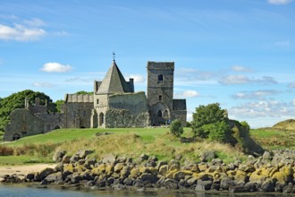 A historic castle on a green field with trees under a blue sky, Inchholm Abbey, Middle Ages, Firth