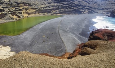 Volcanic landscape with green lagoon and rugged coastline, El Golfo Lanzarote, Canary Island