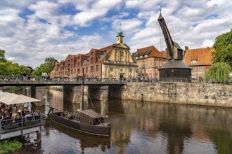 Old harbour with crane and hotel department store in the Hanseatic city of Lüneburg, Lower Saxony,