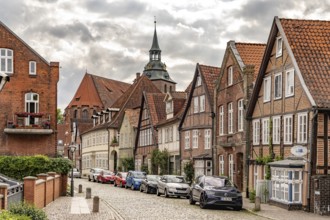 Half-timbered houses in the historic street Auf dem Meere and the St. Michaelis church in the