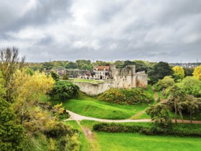 Autumn Colours over ruins of Caldicot Castle from a drone, Caldicot, Monmouthshire, Wales, UK