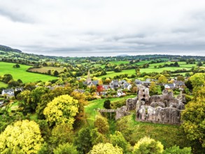 Autumn Colours over ruins of Grosmont Castle from a drone, Grosmont, Monmouthshire, Wales, UK