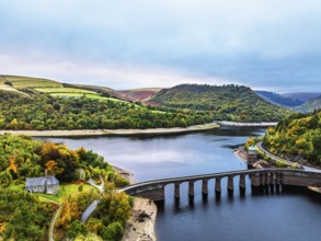 Autumn over Garreg Ddu Dam from a drone, Elan Valley, Caban-Coch Reservoir, Rhayader, Wales, UK