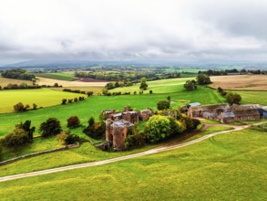 Autumn Colours over ruins of Pembridge Castle or Newland Castle from a drone, Herefordshire,