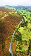 Autumn colours of Farms over River Wye and Road A470 from a drone, Llanidloes, Powys,