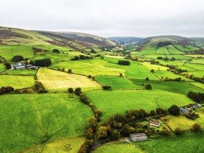 Autumn colours of Farms over River Wye and Road A470 from a drone, Llanidloes, Powys,