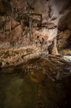 Stalactites and stalagmites, water basins and rock formations in a stalactite cave, Grotta del