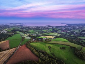 Sunset of Devon Farms and Fields over Berry Pomeroy from a drone, Totnes, England, United Kingdom