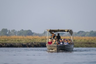 Tourist safari boat in Chobe River, Chobe Waterfront, Ihaha, Chobe National Park, Botswana
