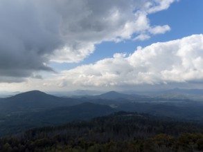 Dramatic weather with dark clouds over low mountain ranges, Bohemian Lusatia, Czech Republic