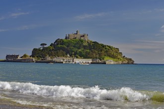 A castle on a hill overlooks the sea with gentle waves, Saint Michael's Mount, Pencanze, Cornwall,