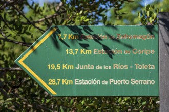 Signpost showing distances along cycle path Via Verde de la Sierra, Puerto Serrano to Olvera, old