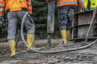 Concreting, concreting the foundation of a wind turbine, concrete pump hose, compressor, more than