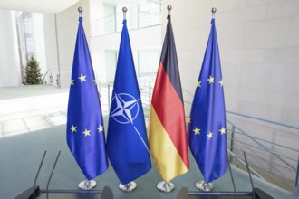 Flags of the Federal Republic of Germany, the EU and NATO after a press conference by Mark Rutte