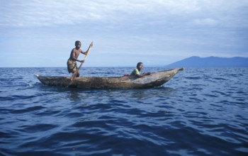 Two boys in a dugout on Lake Malawi, Malawi, Africa, July 2000, vintage, retro, old, historic