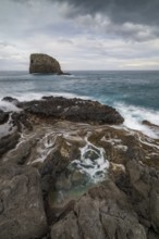Rocky coast, volcanic rock formations, coast near Porto da Cruz, Madeira, Portugal