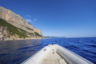 Motorboat trip along the picturesque rocky coast, cliffs and blue sea, Golfo di Orosei, Baunei,