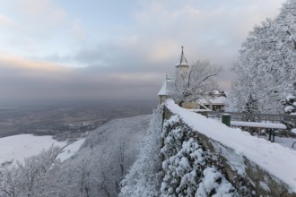 A wonderful winter landscape shows the snow-covered Teck Castle as the first rays of sunshine