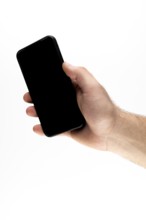 Hand holding a black smartphone against a white background