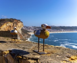 Wooden seagulls, art on the fortress at Farol de Nazare lighthouse, an annual meeting place in