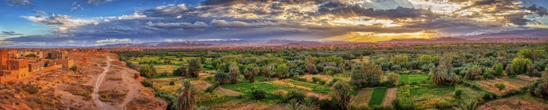 Impressive oasis landscape at sunset with a sky full of clouds, Tinghir in Morocco
