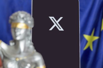 Symbolic picture of the EU Commission's fine against X: Justice, smartphone with logo of X and EU