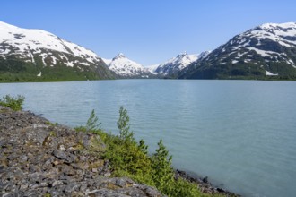 View of mountains with Portage Glacier glacier and turquoise glacial lake Portage Lake, Chugach