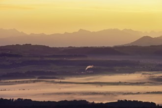 View from Horben of the Reuss Valley covered in fog, behind it the Glarus Alps in the light of the