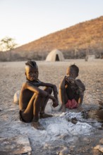 Himba children at the fire early in the morning, traditional Himba village, Kaokoveld, Kunene,
