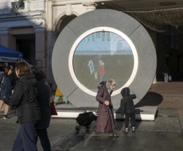 People on the Cornhill in the town centre view the first ever UK Portal in Ipswich, Suffolk,