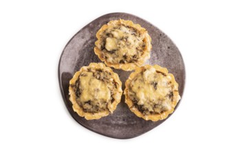 Tartlets with meat and cheese isolated on white background. top view, flat lay, copy space