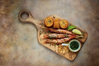Langoustines on skewers, shrimp kebab, with fried corn, spices and herbs, homemade, no people