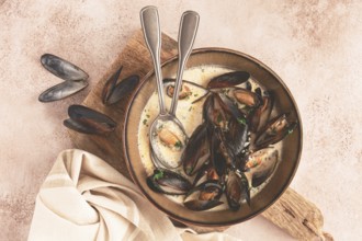 Mussels in creamy garlic sauce, served with fresh herbs and spices, homemade, no people