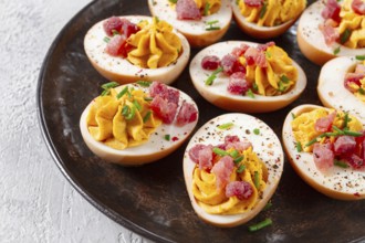 Spicy, stuffed ramen eggs, with bacon and green onions, homemade, no people
