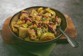Fried green tomatoes, with onions and spices, green tomato appetizer, Georgian cuisine, homemade,