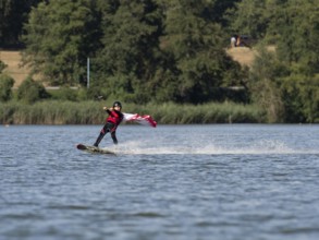 Boy or girl with wakeboard, sporty on the water, active water sports, wake park