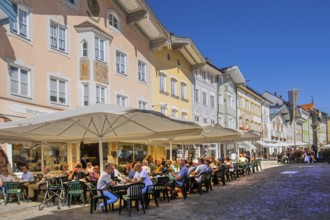 Historic market street with street cafe and typical gabled houses, Bad Tölz. Isartal, Upper