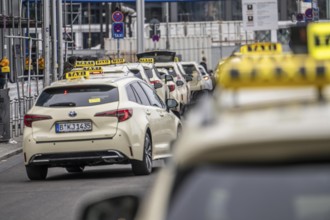 Taxis in front of the main train station in Berlin, waiting in line for passengers, Germany