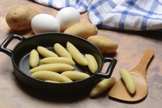 Raw Schupfnudeln in pan, type of pasta, Germany