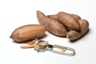 Sweet potato with potato peeler, Ipomoea batatas