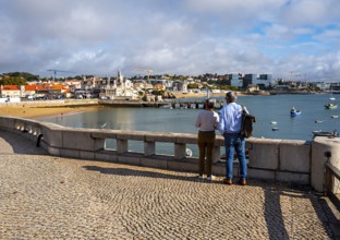 View of the old town and a small stretch of beach by the sea, Cascais, Portugal