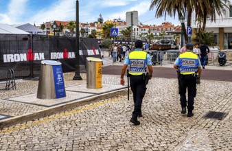 Police officers in uniform on the streets in the resort town of Cascais, Portugal